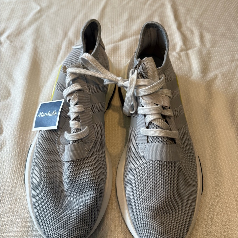 Brand new Adidas gray men’s sneakers size 11.5.